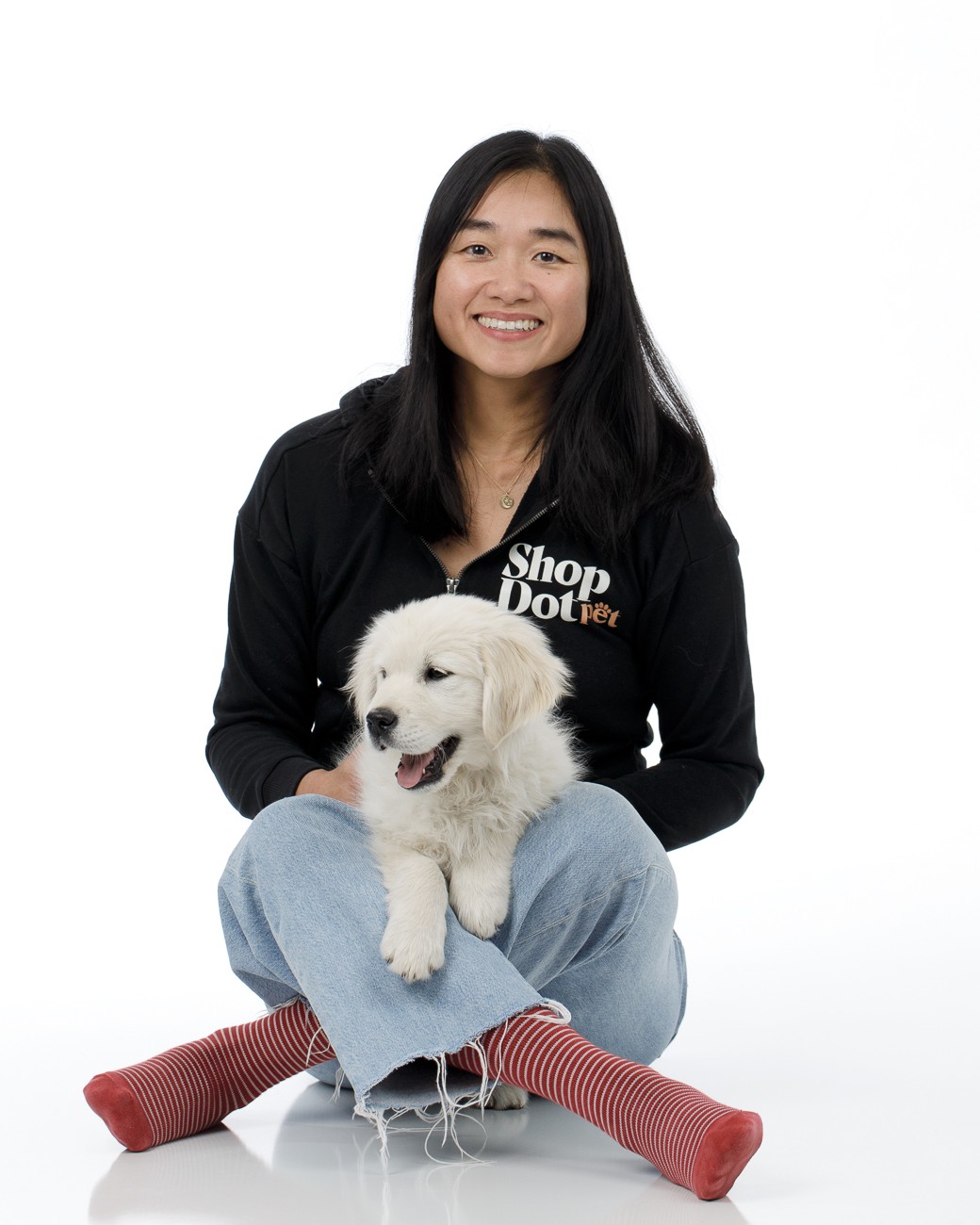 Michelle Huie, Founder and CEO of ShopDot Pet, with a puppy