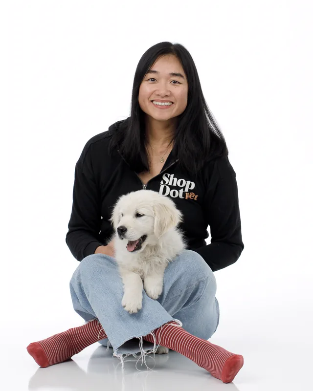 Michelle Huie, Founder and CEO of ShopDot Pet, with a puppy