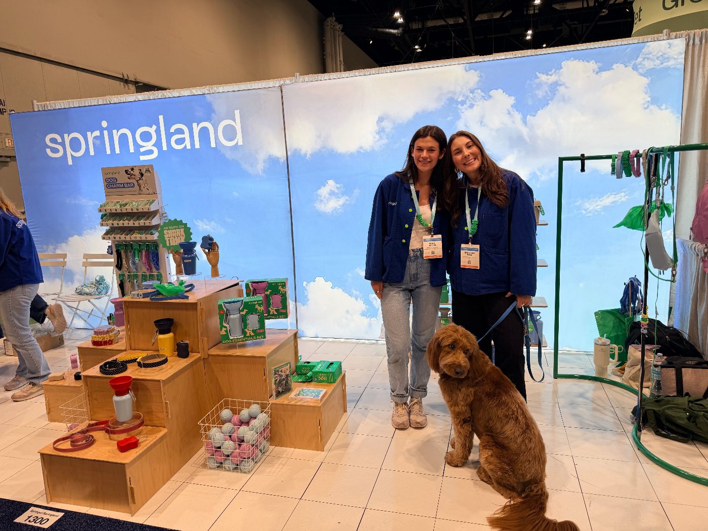 ShopDot with a pet brand and their dog at the expo