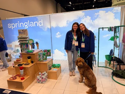 ShopDot with a pet brand and their dog at the expo