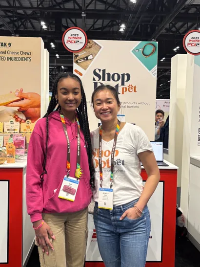 ShopDot at the booth with a fellow pet brand